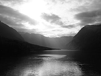 Scenic view of lake against cloudy sky