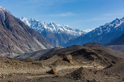 Scenic view of snowcapped mountains against sky