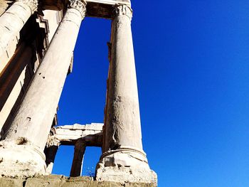 Low angle view of built structure against clear blue sky