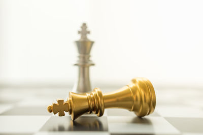 Close-up of chess pieces on table