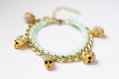 Close-up of necklace on white background