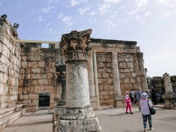 Group of people in front of historical building