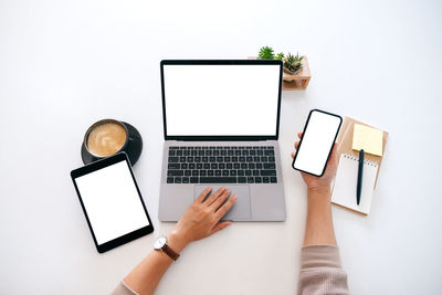 Directly above view of man using laptop on table