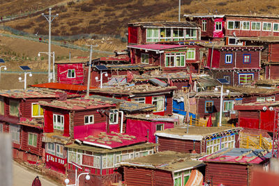 High angle view of multi colored buildings in city