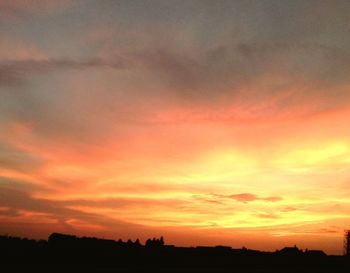 Scenic view of dramatic sky during sunset