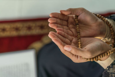 Close-up of man holding hands