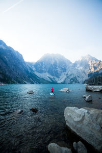 Paddle boarding on an alpine lake 