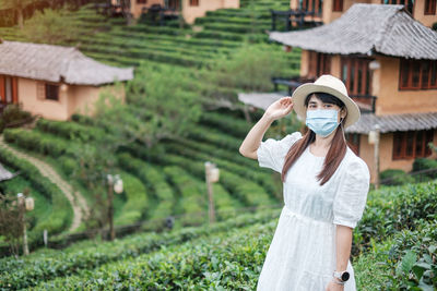 Woman wearing hat on field