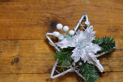 Close-up of christmas decorations on wooden table