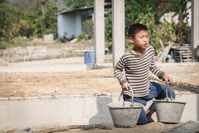 Full length of boy standing outdoors