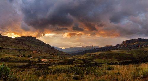 Scenic view of mountains against cloudy sky