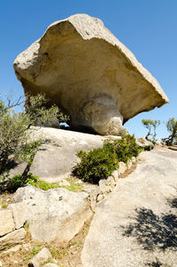 Low angle view of rock formation against clear sky