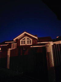 Low angle view of building against sky at night