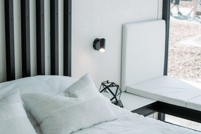 Electric lamp on bed at home