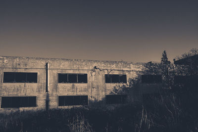 Abandoned building against clear sky