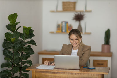 Woman working at home with laptop. home office.  notebook for working. 