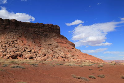 Low angle view of mountain against blue sky
