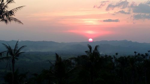 Scenic view of landscape against sky during sunset