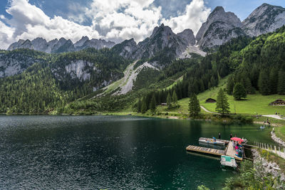 Scenic view of lake and mountains against sky