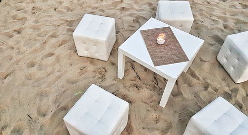 High angle view of chairs on table