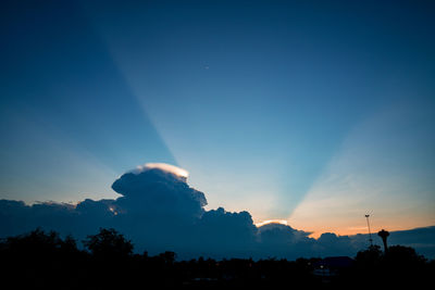 Light in the dark and dramatic storm clouds, sunset sky