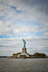 Low angle view of statue against cloudy sky