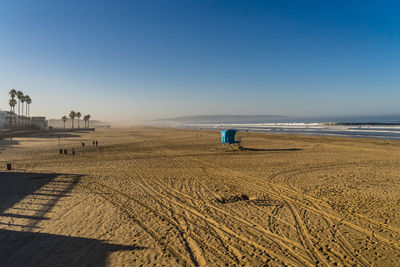 Scenic view of beach against clear sky