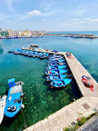 Fishing boats moored at harbor