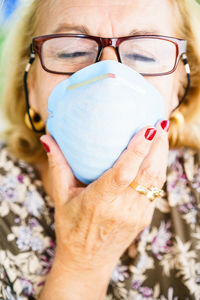 Close-up of senior woman wearing mask