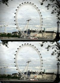 Ferris wheel against cloudy sky