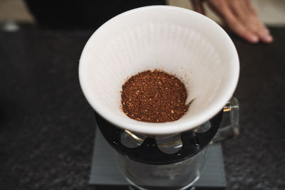 High angle view of coffee cup on table