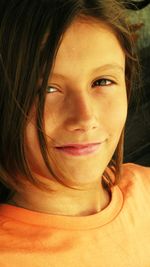 Close-up portrait of a smiling young woman