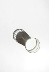 High angle view of drink against white background