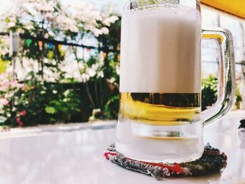 Close-up of beer glass on table