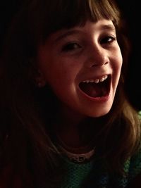 Close-up portrait of girl laughing
