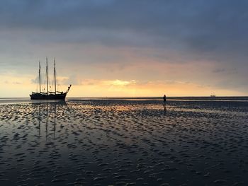 Scenic view of sea against dramatic sky