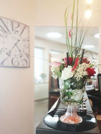 Close-up of flower vase on table at home