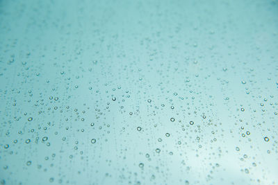 Full frame shot of wet glass window