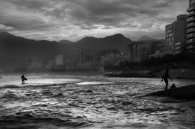 View of sea with buildings in background