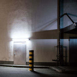 Illuminated building by street