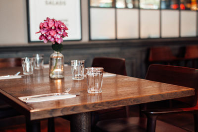 Empty chairs and tables and table and drink on dining