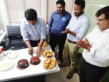 Group of people standing in plate