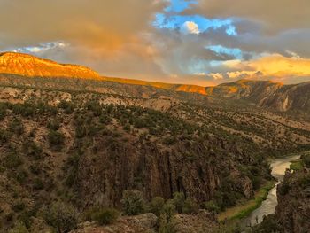 Scenic view of landscape against sky during sunset