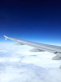 Airplane flying over clouds