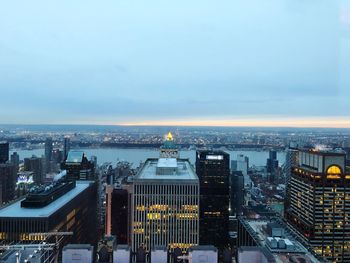 High angle view of illuminated cityscape against sky