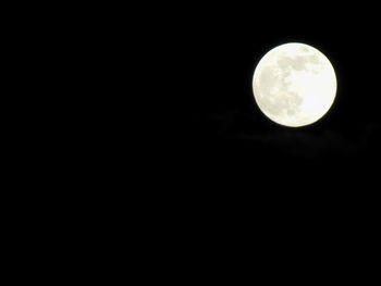 Low angle view of moon against sky at night