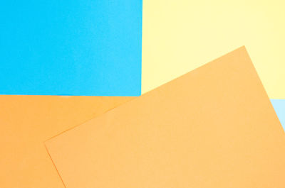 High angle view of paper against clear blue sky