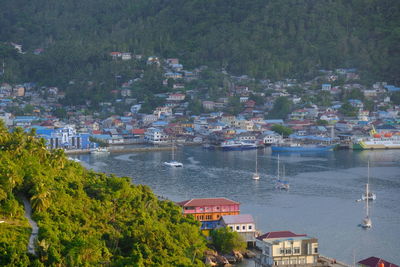 High angle view of townscape by sea