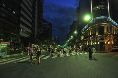 People on city street at night