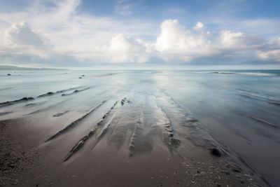 Beach walk. ocean view. long exposure capture of coast and ocean on borneo, sabah - malaysia
